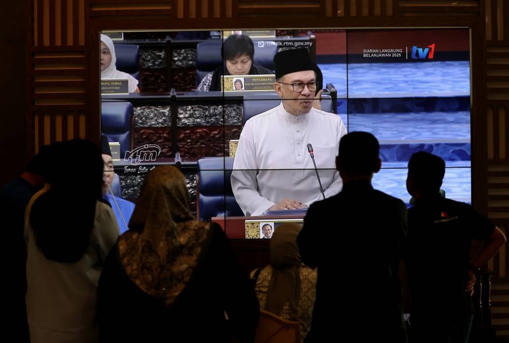 Finance Minister Datuk Seri Anwar Ibrahim when presenting the Malaysia Madani Budget 2025 in Dewan Rakyat on Oct 18. - Photo by Bernama