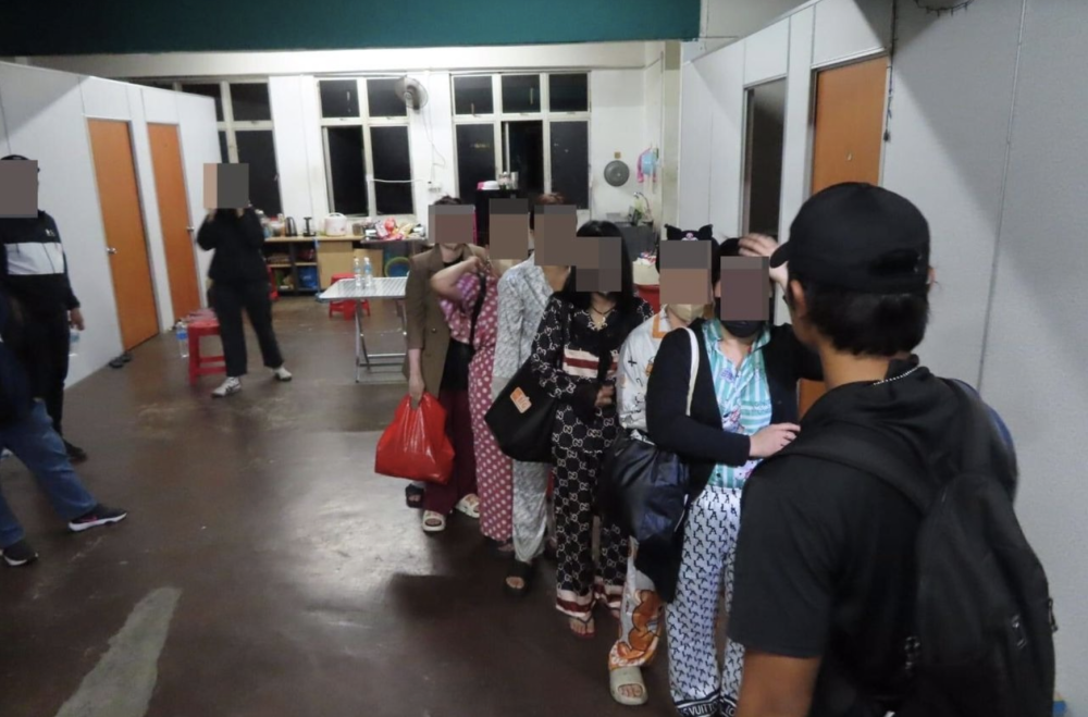 Seven Vietnamese women, victims of a sexual exploitation ring, were rescued in an Immigration Department operation on a two-story shophouse in Klang, Selangor Oct 21. - Photo by Bernama