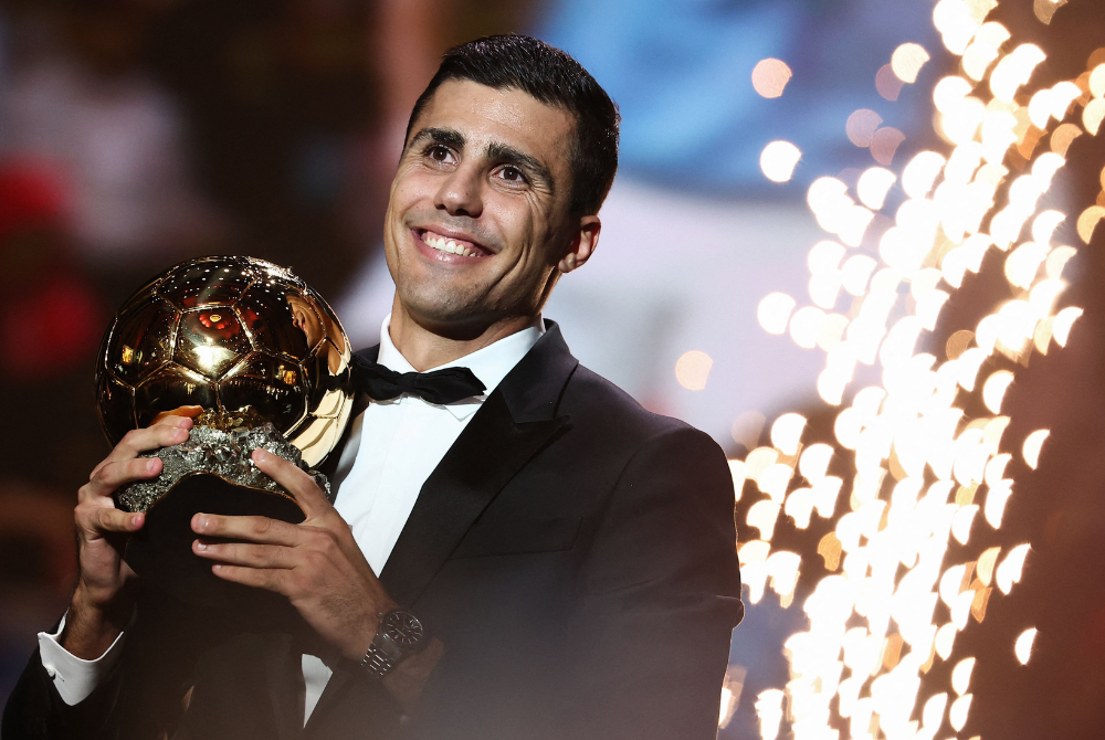 Manchester City's Spanish midfielder Rodri receives the Ballon d'Or award during the 2024 Ballon d'Or France Football award ceremony at the Theatre du Chatelet in Paris on October 28, 2024. (Photo by FRANCK FIFE / AFP)