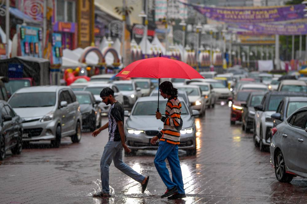 Thunderstorms, heavy rain and strong winds are expected over eight states until 12pm today. - Photo by Bernama