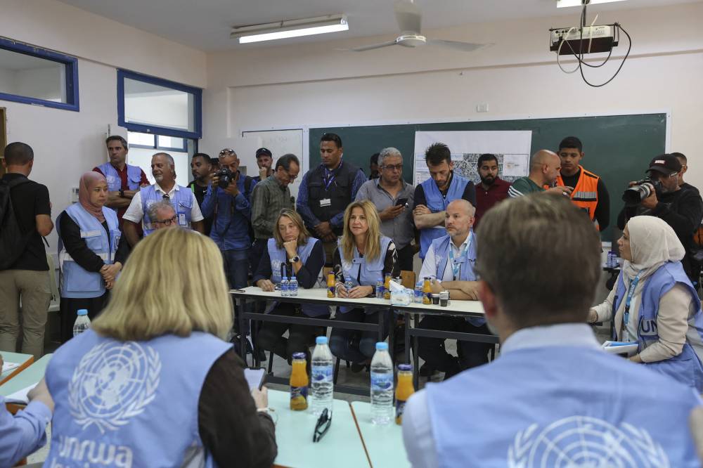 A delegation of international envoys visits the UNRWA camp school during a tour of the Jenin camp for Palestinian refugees in the Israeli-occupied West Bank, on July 8, 2023. - (Photo by ZAIN JAAFAR / AFP)