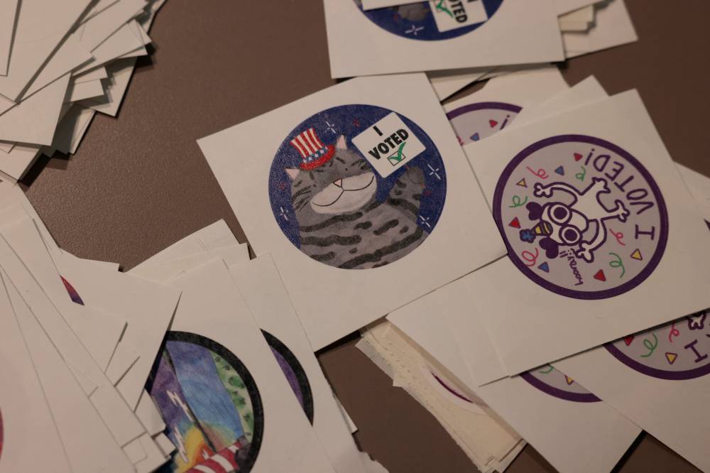"I Voted" stickers are seen during early voting for the US general election at the University of Michigan Museum of Art Gallery in Ann Arbor, Michigan, on October 31, 2024. - (Photo by JEFF KOWALSKY / AFP)