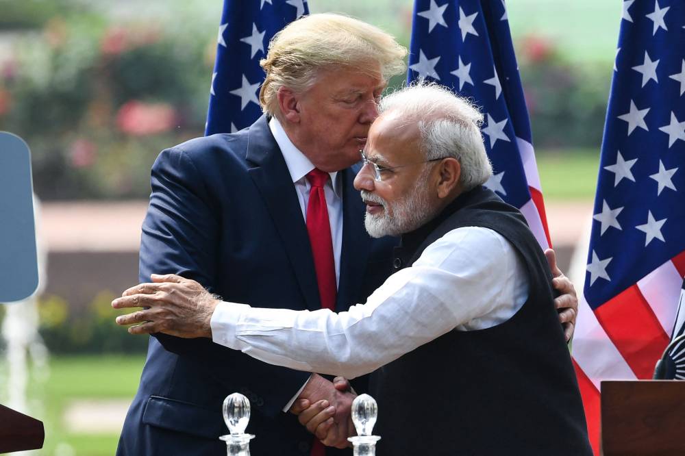 Donald Trump (L) shakes hands with India's Prime Minister Narendra Modi during a joint press conference at Hyderabad House in New Delhi on February 25, 2020. Indian Prime Minister Narendra Modi and Donald Trump call each other friends, but analysts say that looming trade disputes will test their cozy relationship when the latter again becomes US president in 2024. (Photo by Prakash SINGH / AFP)