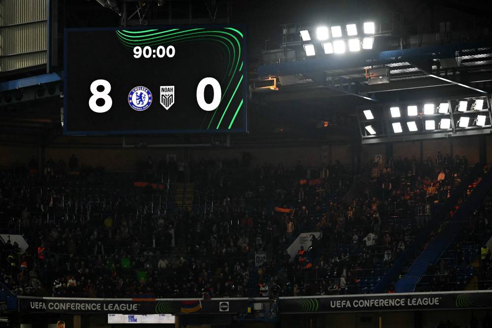An electronic screen shows the 8-0 score at the end of the UEFA Europa Conference League, League Stage football match between Chelsea and FC Noah at Stamford Bridge in London on November 7, 2024. Chelsea won the match 8-0. (Photo by Glyn KIRK / AFP)