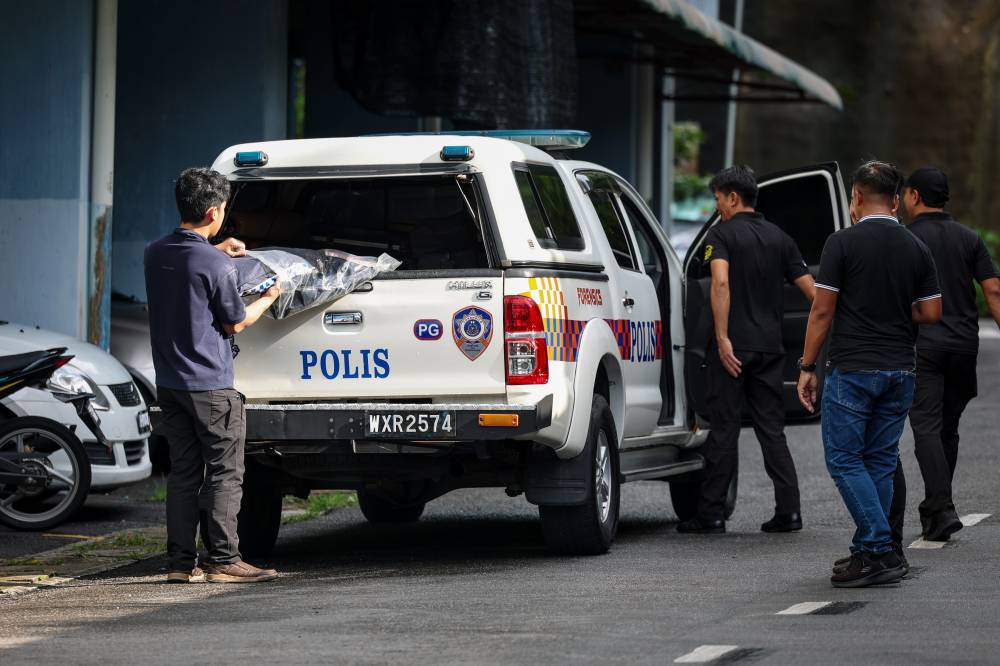 Yesterday, a father and daughter aged 62 and 30 died believed to have been stabbed by a man in an incident at an apartment in Bandar Baru Farlim, Air Itam here. Photo by Bernama