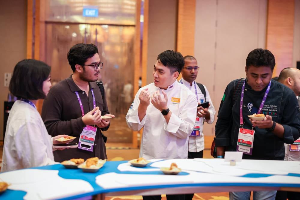 Chef Pop promoting Modernised Comfort Food in his cooking at the Expo.