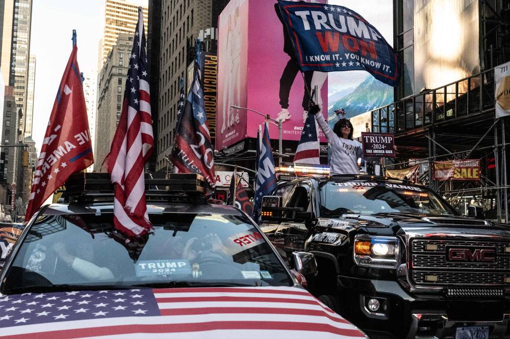 People participate in a car caravan in support of US President-elect Donald Trump on November 9, 2024 in New York City. - Photo by AFP