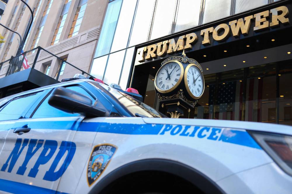 A New York City Police Department (NYPD) vehicle sits in front of Trump Tower on Fifth Avenue in New York City on November 12, 2024. (Photo by Charly TRIBALLEAU / AFP)