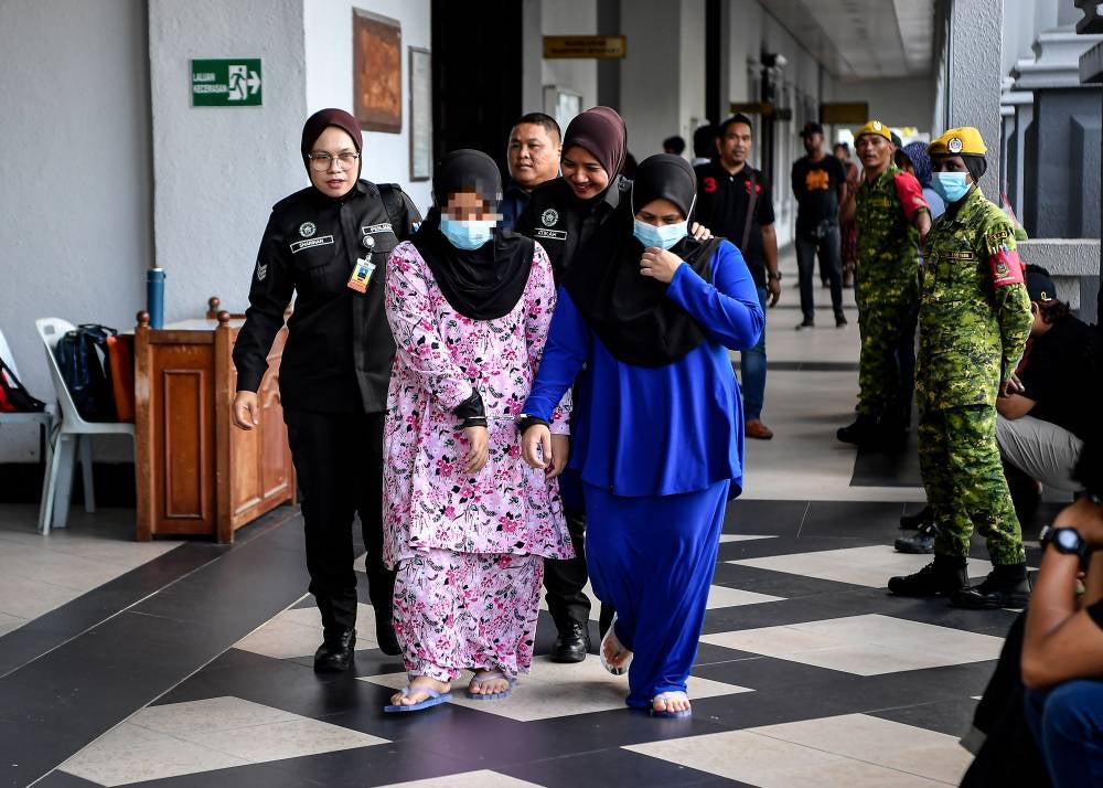 A mother and her friend were sentenced to three years in prison by the Sessions Court today for confining a young boy in a cat cage in February. Photo by Bernama