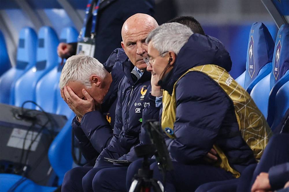 France's head coach Didier Deschamps reacts next to France's assistant coach Guy Stephan during the UEFA Nations League League A, Group A2 football match between France and Israel at The Stade de France stadium in Saint-Denis, in the northern outskirts of Paris, on November 14, 2024. (Photo by FRANCK FIFE / AFP)