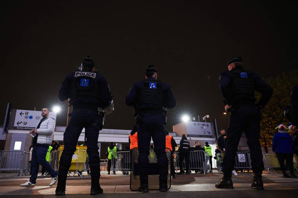 French police officers patrol ahead of the UEFA Nations League League A, Group A2 football match between France and Israel at The Stade de France stadium in Saint-Denis, in the northern outskirts of Paris, on November 14, 2024. (Photo by FRANCK FIFE / AFP)