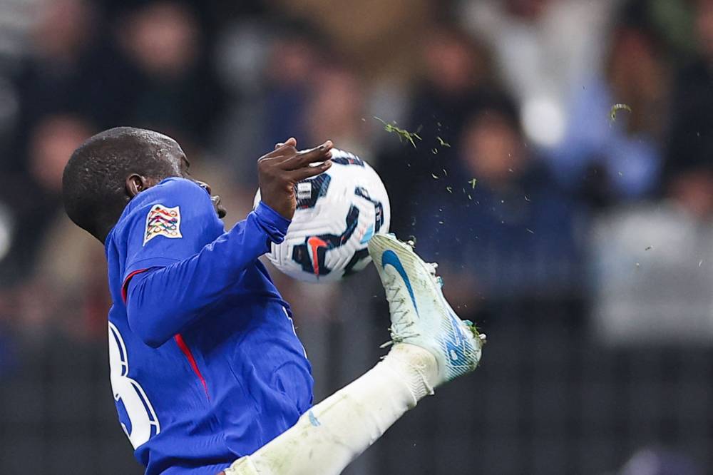 Israel's midfielder #22 Mahmoud Jaber fights for the ball with France's midfielder #13 N'Golo Kante during the UEFA Nations League League A, Group A2 football match between France and Israel at The Stade de France stadium in Saint-Denis, in the northern outskirts of Paris, on November 14, 2024. (Photo by FRANCK FIFE / AFP)