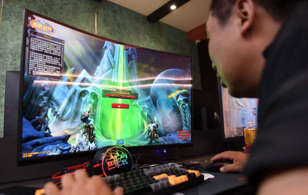People play World of Warcraft at an E-Sports centre in Jinzhou, in China’s central Hubei province on August 1, 2024. - AFP