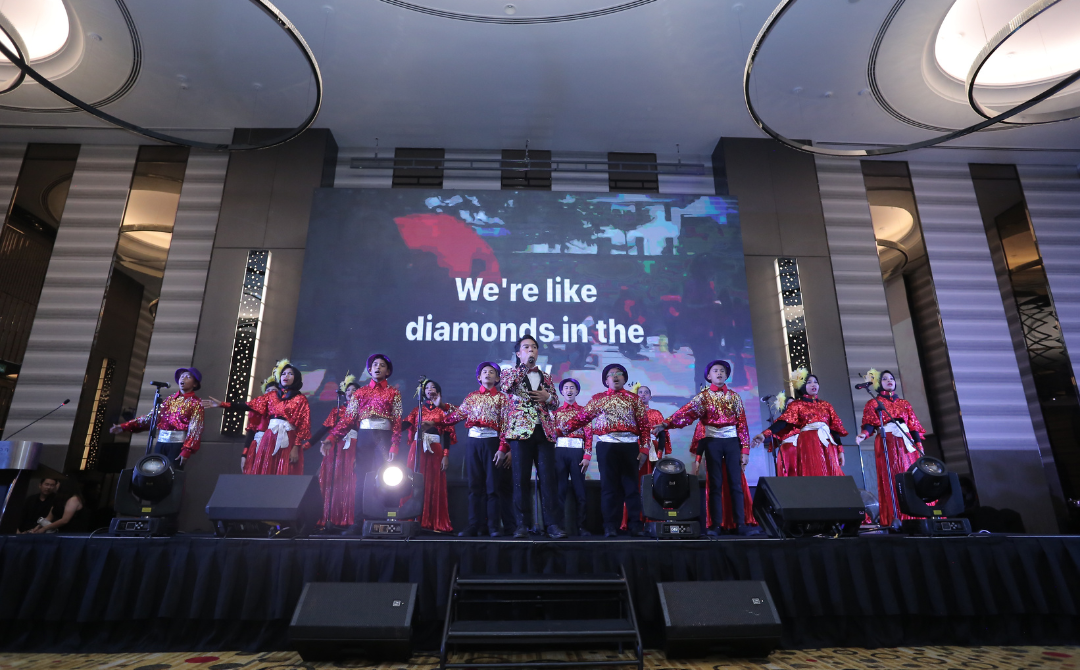 The event includes performances, including the Budimas Orion Home’s Choir, traditional Gendang, dance displays, and lively music. - Photo by Budimas