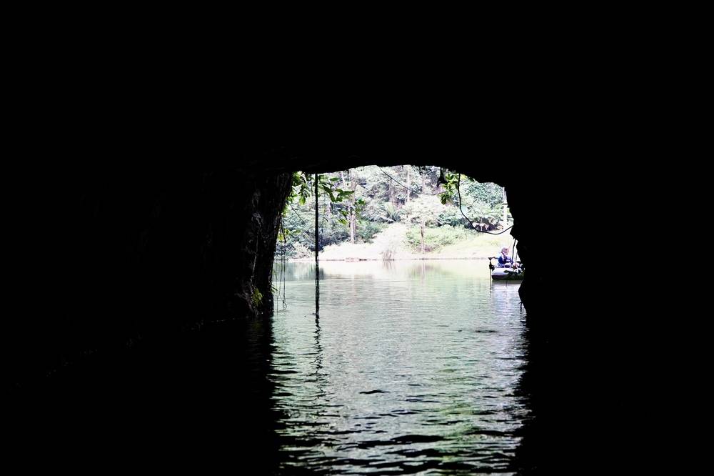Emerging from a dark, 130-meter-long water tunnel during the boat ride into Tasik Cermin 2 feels like stepping into another world. Photo: Islamic Tourism Centre