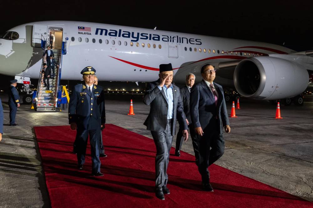 In Dewan Rakyat yesterday, Anwar explained the government’s new strategy to reduce overseas travel expenses was to invite companies such as Petronas, Proton, and others to participate. - Photo credit: Anwar Ibrahim/Facebook