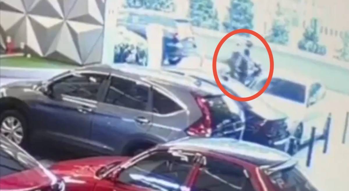 CCTV screengrab of the acid attack on national footballer Faisal Halim.