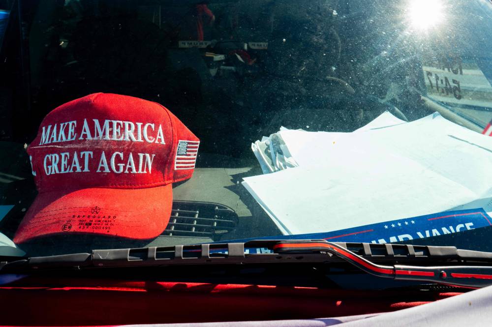 Apparel of US President-elect Donald Trump is seen in the inside of a car near the Mar-a-Lago Club on November 25, 2024 in Palm Beach, Florida. - Photo by AFP