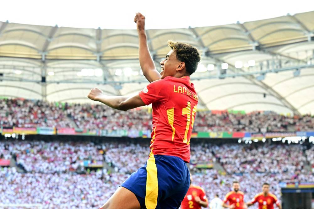 Spain's forward Lamine Yamal celebrates his team's first goal during the UEFA Euro 2024 quarter-final football match between Spain and Germany at the Stuttgart Arena in Stuttgart on July 5, 2024. (File photo by AFP)
