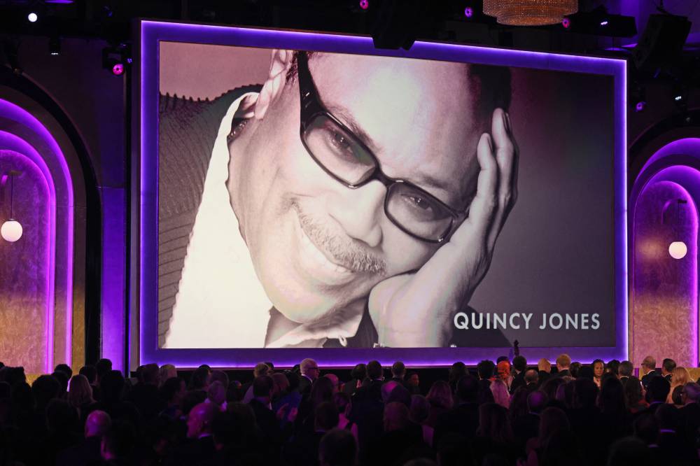 Late US record producer Quincy Jones appears on screen as he receives and honorary award during the Academy of Motion Picture Arts and Sciences' 15th Annual Governors Awards at the Ray Dolby Ballroom in Los Angeles on Nov 17, 2024. (Photo by Etienne Laurent / AFP)