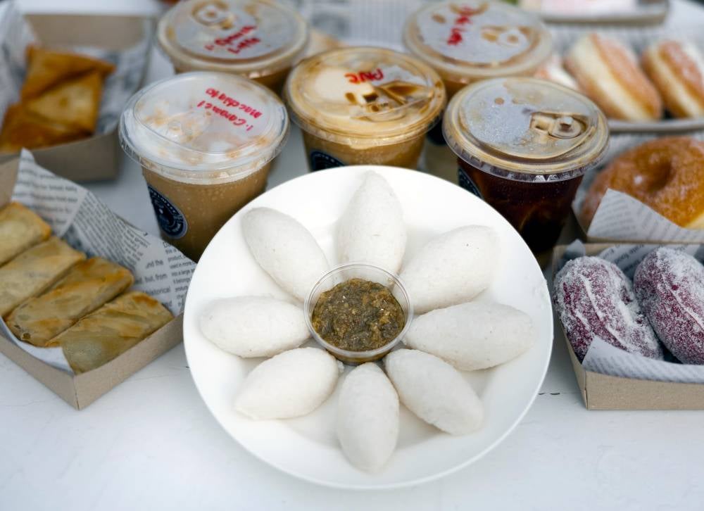 Delight in the savoury flavours of punten, a traditional Javanese dish, complemented by a freshly brewed cup of coffee while soaking in the serene beauty of endless green padi fields at Punten N Coffee. Photo by Bernama