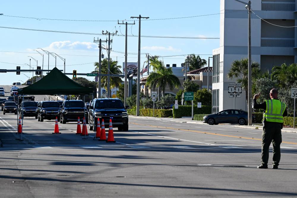 The motorcade of US President-elect Donald Trump heads back from Trump International Golf Club to Mar-a-Lago, his residence in West Palm Beach, Florida, on November 27, 2024. (Photo by CHANDAN KHANNA / AFP)