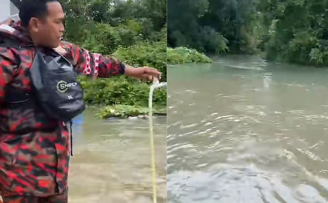Screenshots video of two firefighters appear to close a water valve while standing in the midst of rising floodwaters. - Source: Instagram 