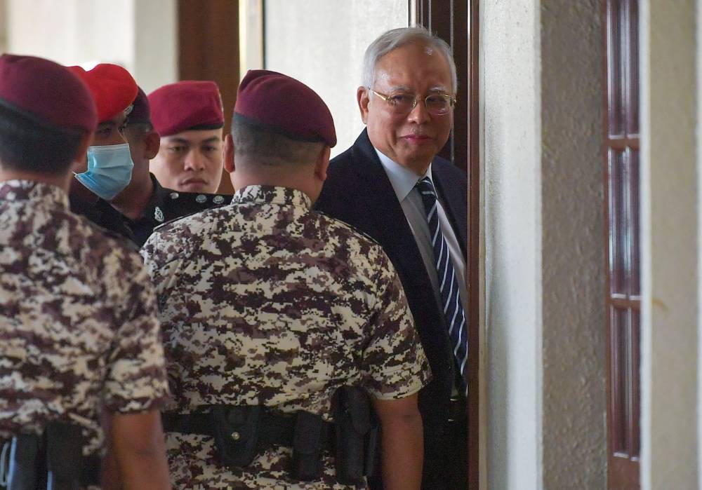 Former prime minister Datuk Seri Najib Razak at the Kuala Lumpur High Court for his 1MDB trial, today. - Photo by Bernama