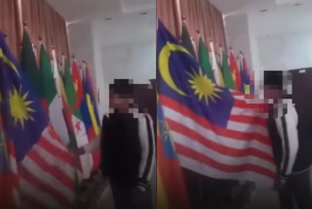 In the video, 'Fred' was reportedly seen lifting the flag, spitting on it twice, and hurling profanities. Photo source: World of Buzz 