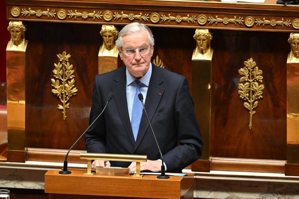 French Prime Minister Michel Barnier delivers a speech during the debate prior to the no-confidence votes on his administration at the National Assembly in Paris, France. Photo by Mustafa Yalçın/Anadolu Agency