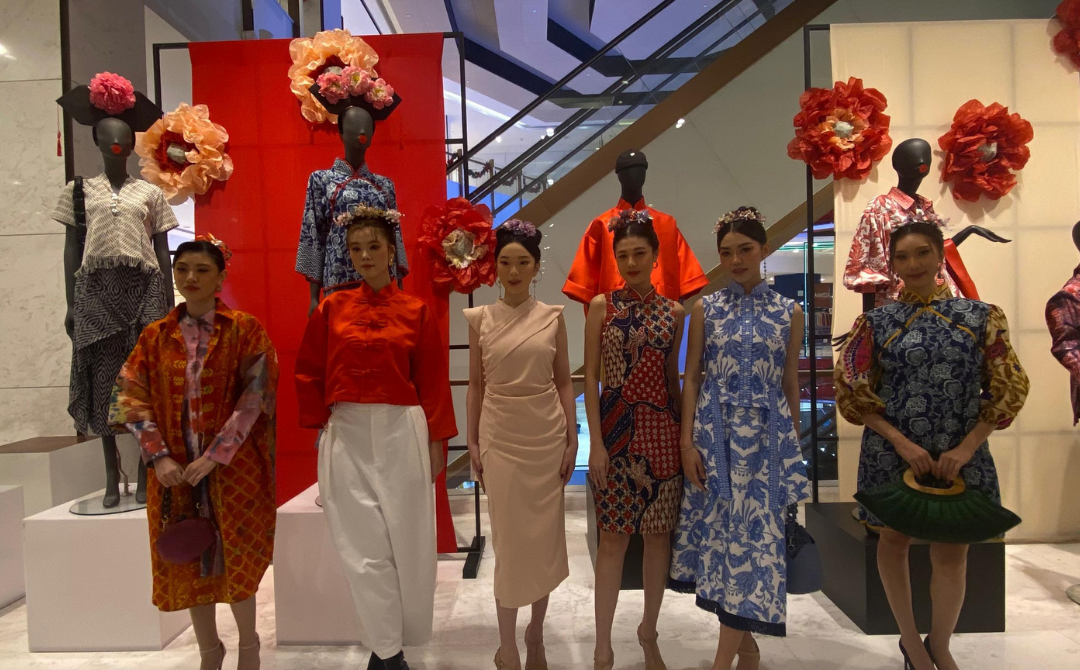 Models showcasing pieces from the Spring Overture (CNY'25) fashion collection.