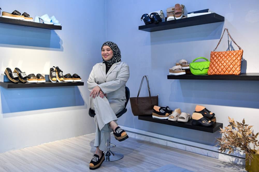 Entrepreneur Noorfarahida Rosli poses with her shoe products at her store, ‘theflickstore,’ in Senawang recently. - Photo by Bernama