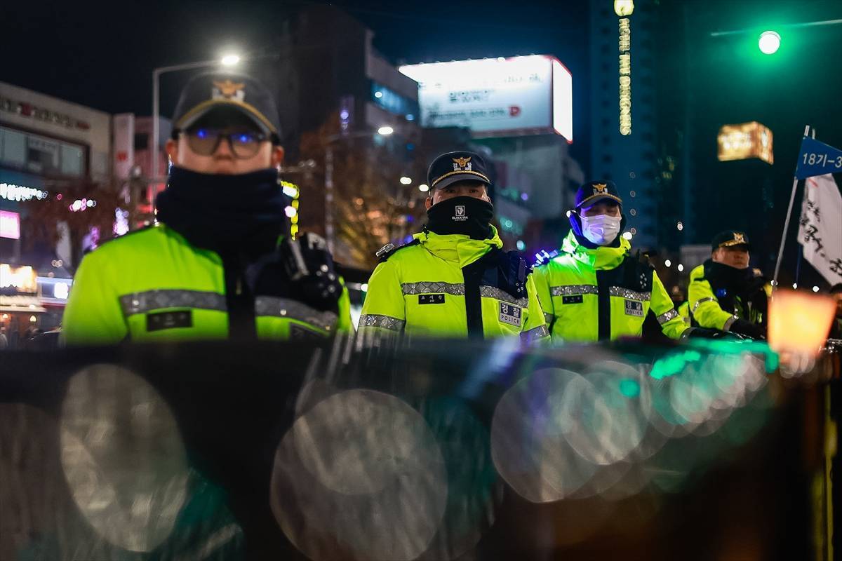 Police officers stand guards during an anti-Yoon Suk Yeol public activity, as the South Korean President is expected to face impeachment following his declaration of an emergency martial law, in Seoul, South Korea, on 04 December, 2024. - Photo by Anadolu Agency