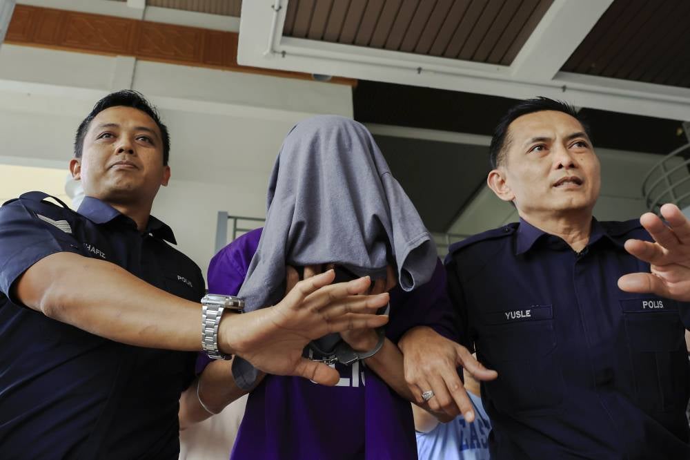 The suspect was brought to court earlier today to face the charges. Photo by Bernama