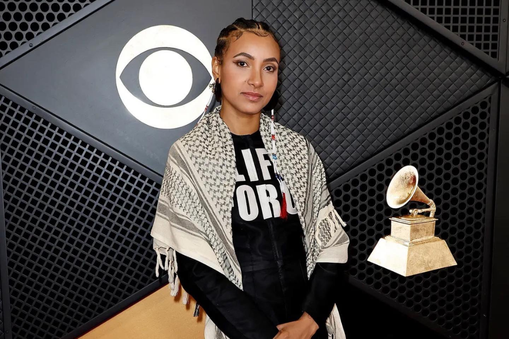 Esperanza Spalding in a keffiyeh at the Grammy 2024 Red Carpet Look.