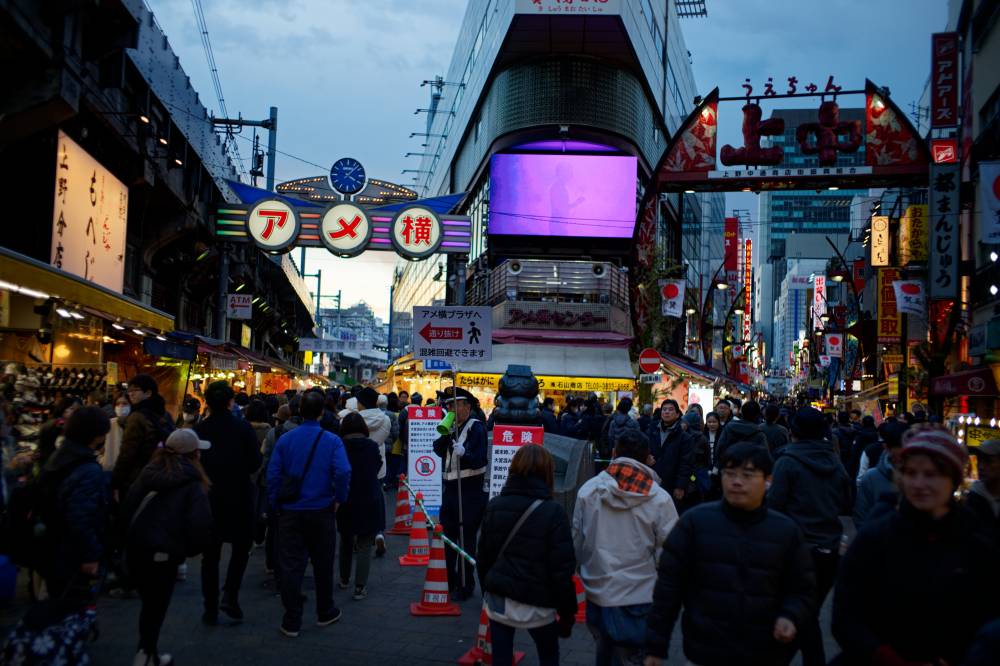 People visit a commercial street in Tokyo, Japan on Dec 28, 2024. - (Photo by Zhang Xiaoyu / XINHUA)