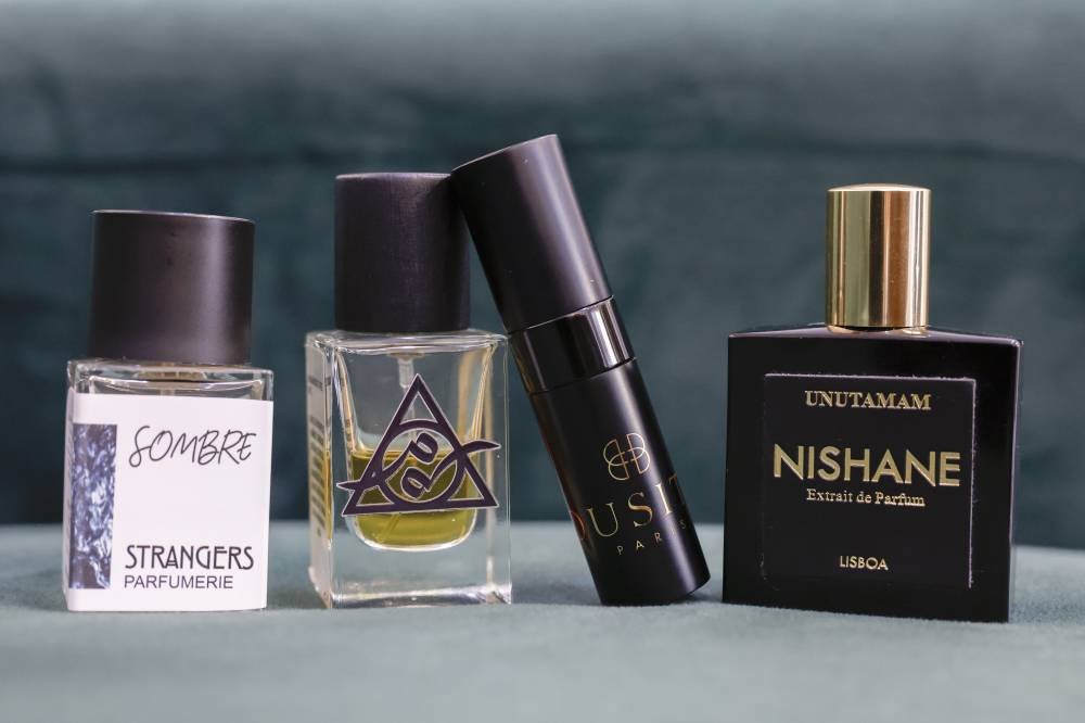 Four favourite perfumes of Muhamad Lukman Nur Hakim Rosmizan, 24, (from left) include Sombre Strangers Parfumerie with a scent resembling blood, Manikam Parfvms (animalic), Dusita Oudh Infini (faeces) and Nishane Unutamam (animalic). - Photo by Bernama