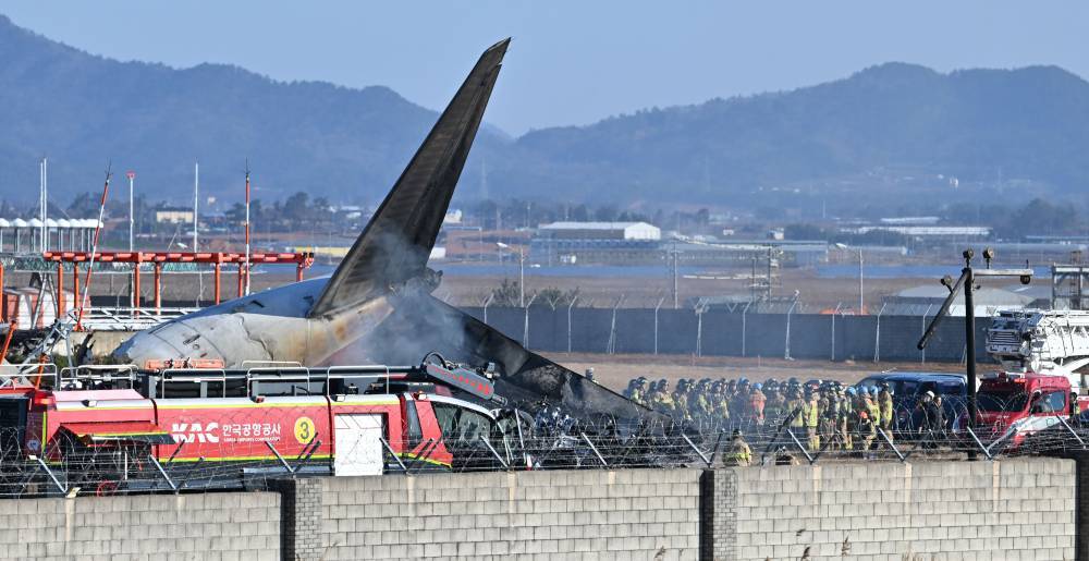This photo shows the site of an airplane crash at an airport in Muan, southwest South Korea, on Dec 29, 2024. - (Photo by NEWSIS via Xinhua)