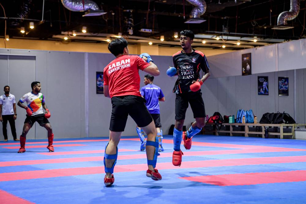 Thevendran (right) has grown into a disciplined individual with good time management to lead his path into the national team to bag several medals in regional events, besides having reached the Junior World Championship quarter-finals. - Photo by Bernama