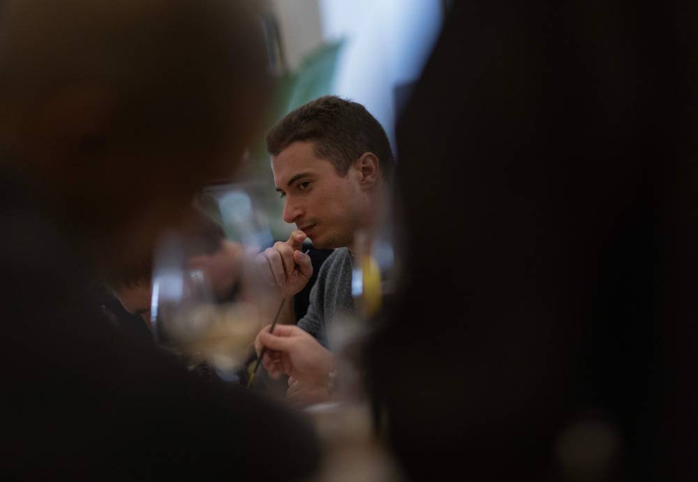 A group of people take part in a singles meeting organised by the "Slow dating club" in Madrid on December 29, 2024. (Photo by Pierre-Philippe MARCOU/AFP)