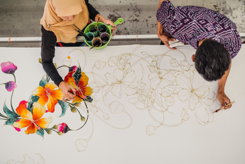 Since independence in 1957, batik has played a significant role in shaping Malaysia's identity. - Canva