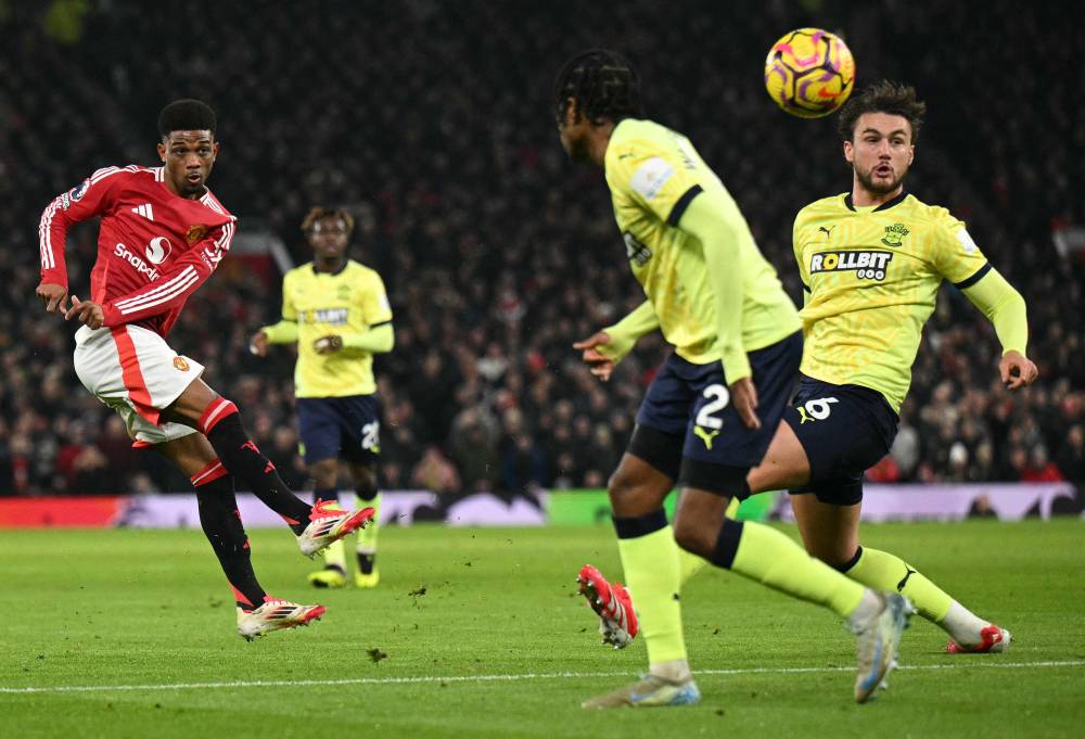 Manchester United's Ivorian midfielder Amad Diallo shoots wide during the English Premier League football match between Manchester United and Southampton at Old Trafford in Manchester, north west England, on January 16, 2025. (Photo by Oli SCARFF/AFP)
