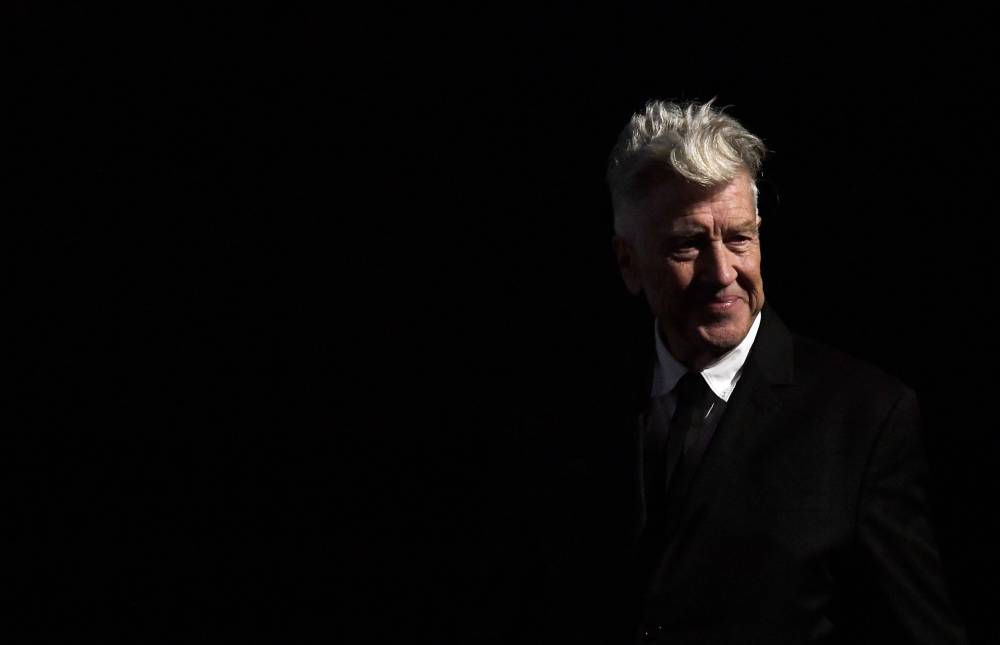 US director David Lynch poses after receiving a lifetime achievement award during the 12th Rome Film Festival on November 4, 2017 in Rome. Lynch -- the groundbreaking director behind "Mulholland Drive" and television's "Twin Peaks," who gained a cult following for his unsettling portraits of American life -- has died. He was 78 years old. (Photo by TIZIANA FABI / AFP)
