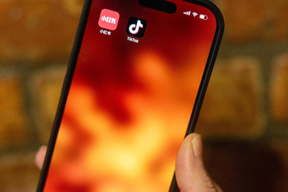 In this photo illustration, the TikTok logo is displayed on a phone on January 17, 2025 in New York City. - AFP file photo