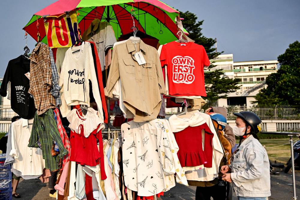 Vietnam is among the world's largest exporters of clothing, footwear and furniture and Ho Chi Minh City and its hundreds of thousands of migrant workers have for decades helped power its manufacturing boom. (Photo by Nhac NGUYEN/AFP)