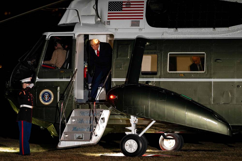 US President Donald Trump steps off Marine One upon arrival at the White House in Washington, DC on Jan 27, 2025. - (Photo by Kent Nishimura / AFP)
