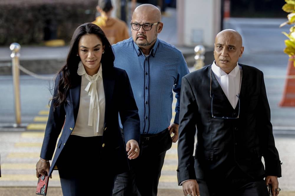 Comedian and actor Harith Iskander arrives at the Kuala Lumpur Courts Complex, today, to hear the charges against a man accused of threatening to kill him and his family. - Photo by Bernama
