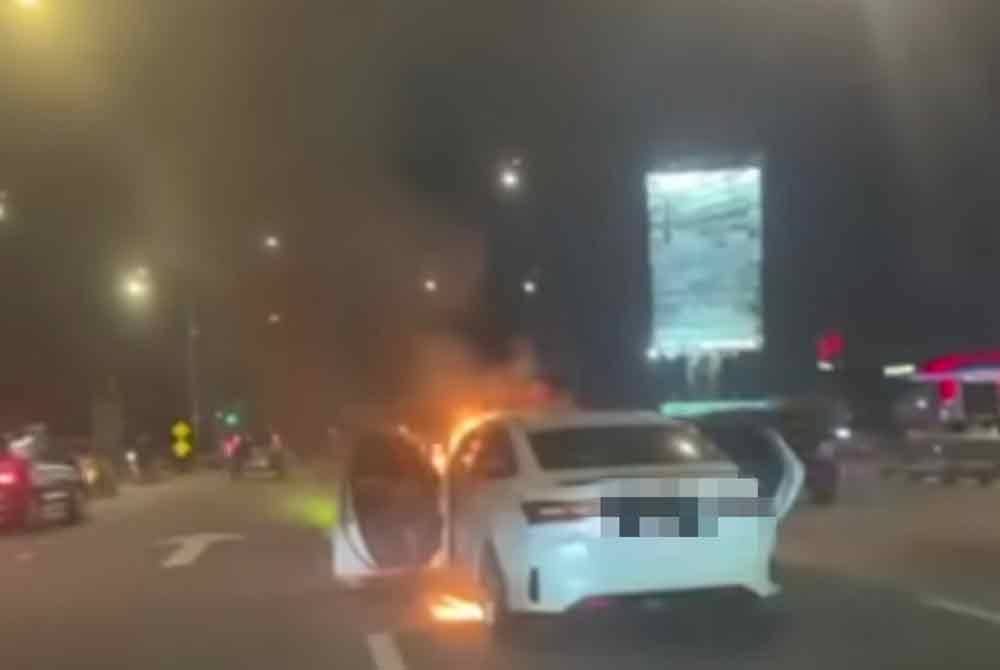 Police are tracking down a 25-year-old man for allegedly setting fire to his wife's car at Jalan Tebrau here yesterday.