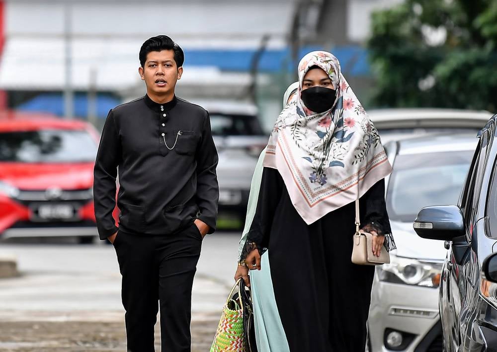 Zayn Rayyan's parents Zaim Ikhwan Zahari and Ismanira Abdul Manaf at the Petaling Jaya Sessions Court, today. - Photo by Bernama