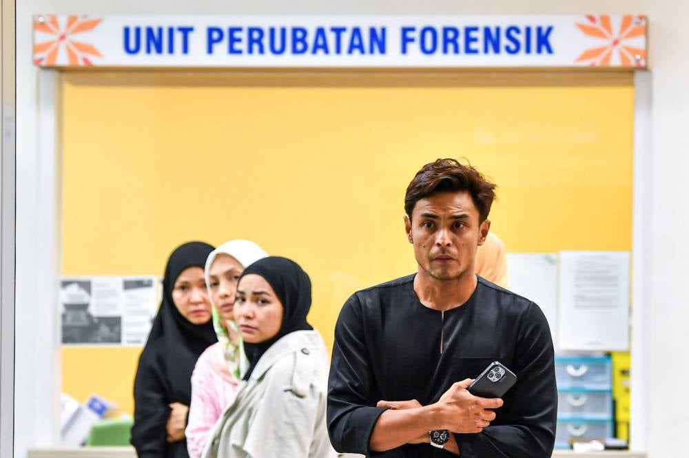 A check at the Hospital Rembau Forensic Unit at 10.30pm saw several family members and close friends, including former national footballer Mohd Safee Mohd Sali, present to support the grieving couple. - Bernama photo